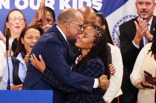 New York City Schools Chancellor David Banks hugs his partner, First Deputy Mayor Sheena Wright.