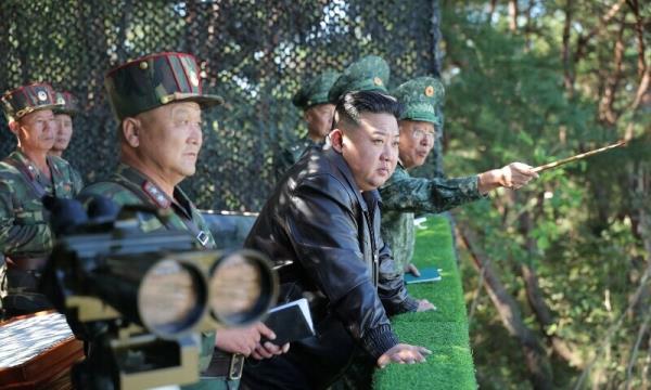 This picture taken on Oct 2, 2024 and released from North Korea’s official KCNA via KNS on Oct 4, 2024 shows North Korea’s leader Kim Jong Un (C) inspecting a training ba<em></em>se of the Korean People’s Army’s special operations forces in the western region, at an undisclosed location in North Korea. — AFP