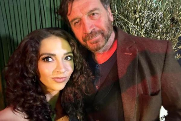 Strictly star Nick Knowles wearing a brown suit next to his fiancee Katie Dadzie