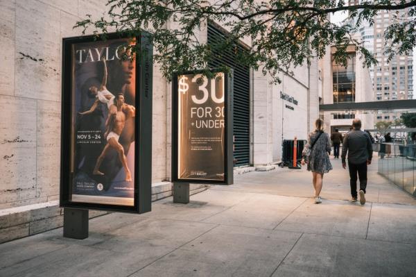 Signs showing the $30-for-30 discount.